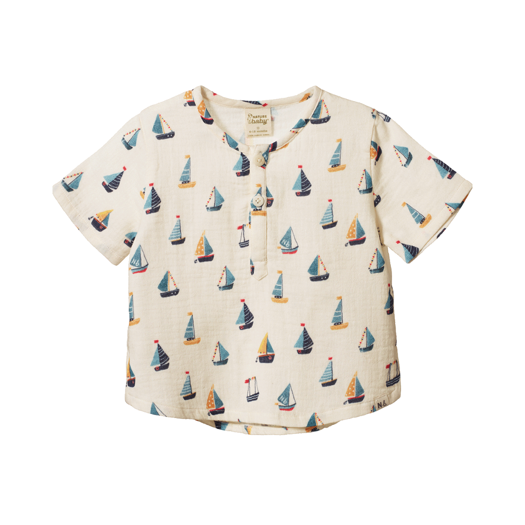 Short Sleeve Caravan Shirt flat lay, baby boy organic cotton henley shirt , boat print— Willowby, sizes 6–18 months