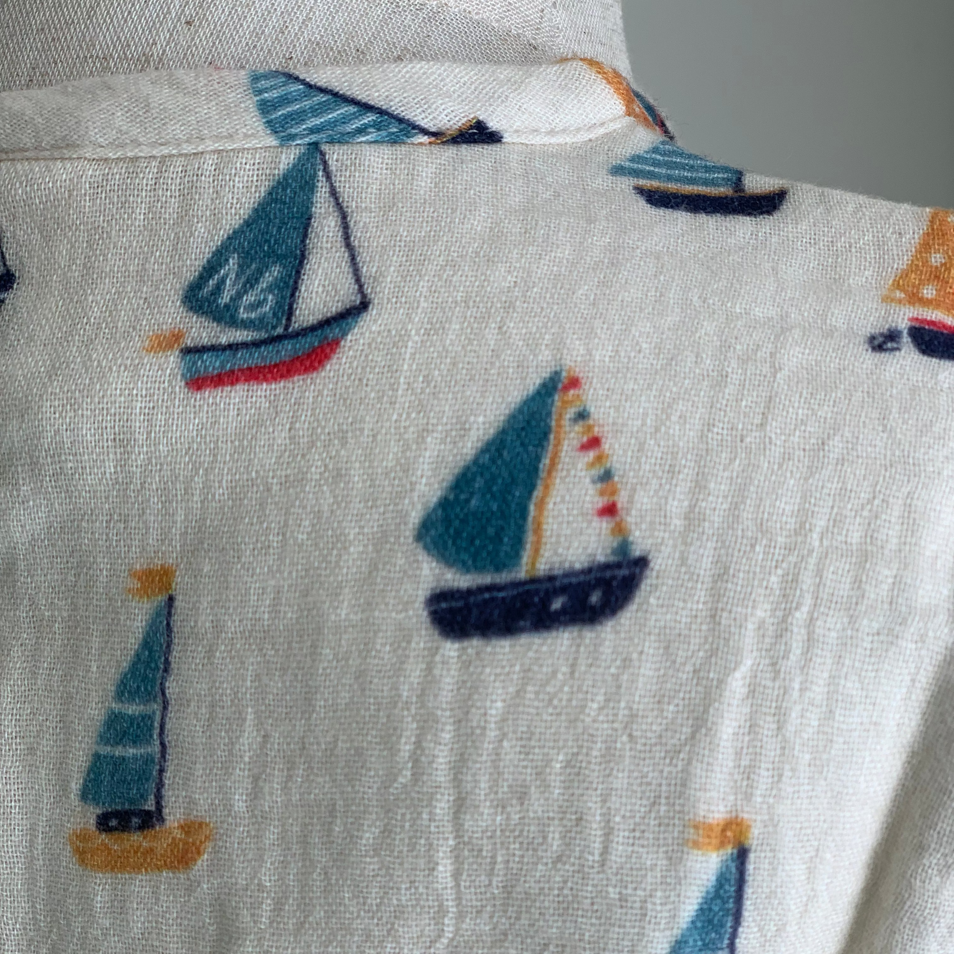 Short Sleeve Caravan Shirt on mannequin, baby boy organic cotton henley shirt , close up boat print— Willowby, sizes 6–18 months