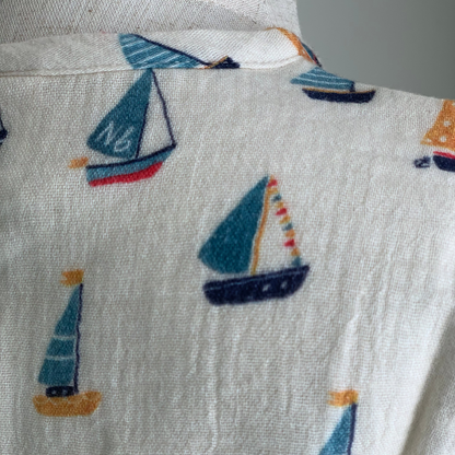 Short Sleeve Caravan Shirt on mannequin, baby boy organic cotton henley shirt , close up boat print— Willowby, sizes 6–18 months
