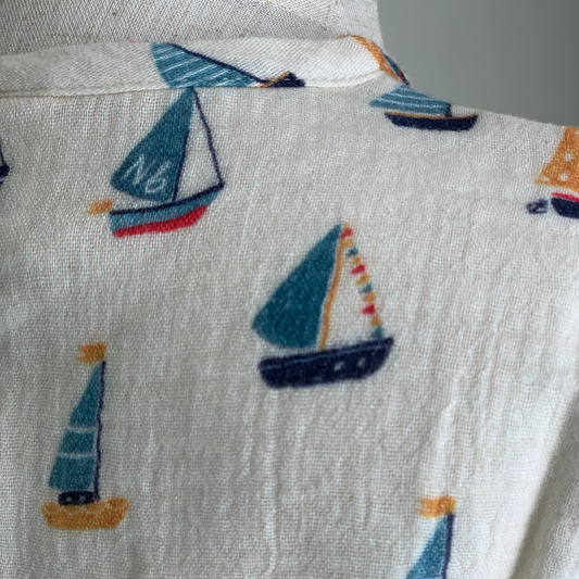 Short Sleeve Caravan Shirt on mannequin, baby boy organic cotton henley shirt , close up boat print— Willowby, sizes 6–18 months