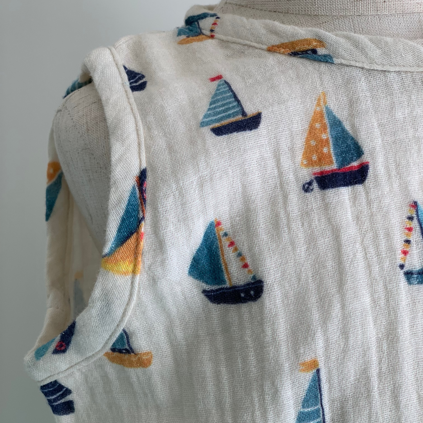 Cedar Suit on mannequin, baby organic cotton romper  close up, boat print— Willowby, sizes 6–18 months