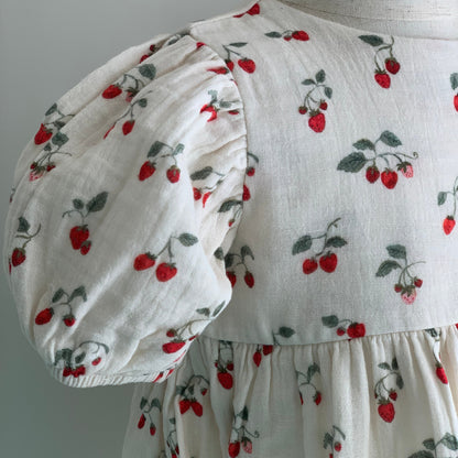 Albertine Dress on mannequin, baby girl organic cotton dress, close up, puff sleeve detail  — Willowby, sizes 6–18 months