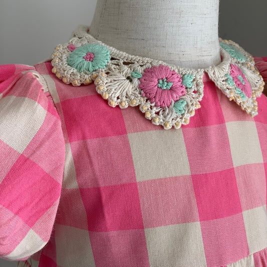 Anais Romper on mannequin close up, baby girl cotton pink check romper, crotched collar — Willowby, sizes 6–18 months