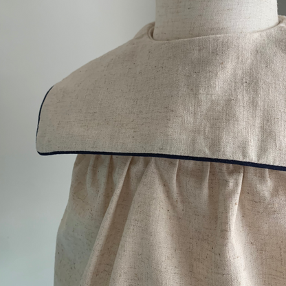 Melchior Romper on mannequin, baby boy  cotton-linen blend romper, collar detail — Willowby, sizes 6–18 months