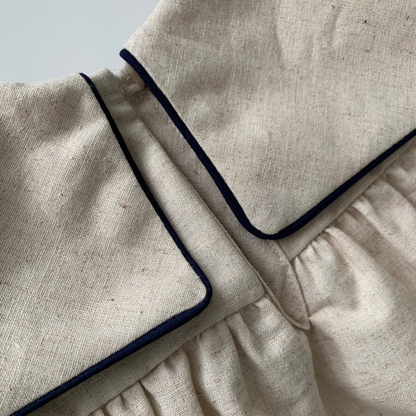 Melchior Romper on mannequin, baby boy  cotton-linen blend romper, back view collar detail — Willowby, sizes 6–18 months
