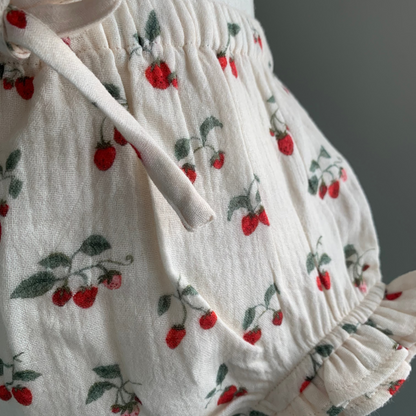 Bloomers on mannequin, close up, baby girl organic cotton bloomers, strawberry print  — Willowby, sizes 6–18 months