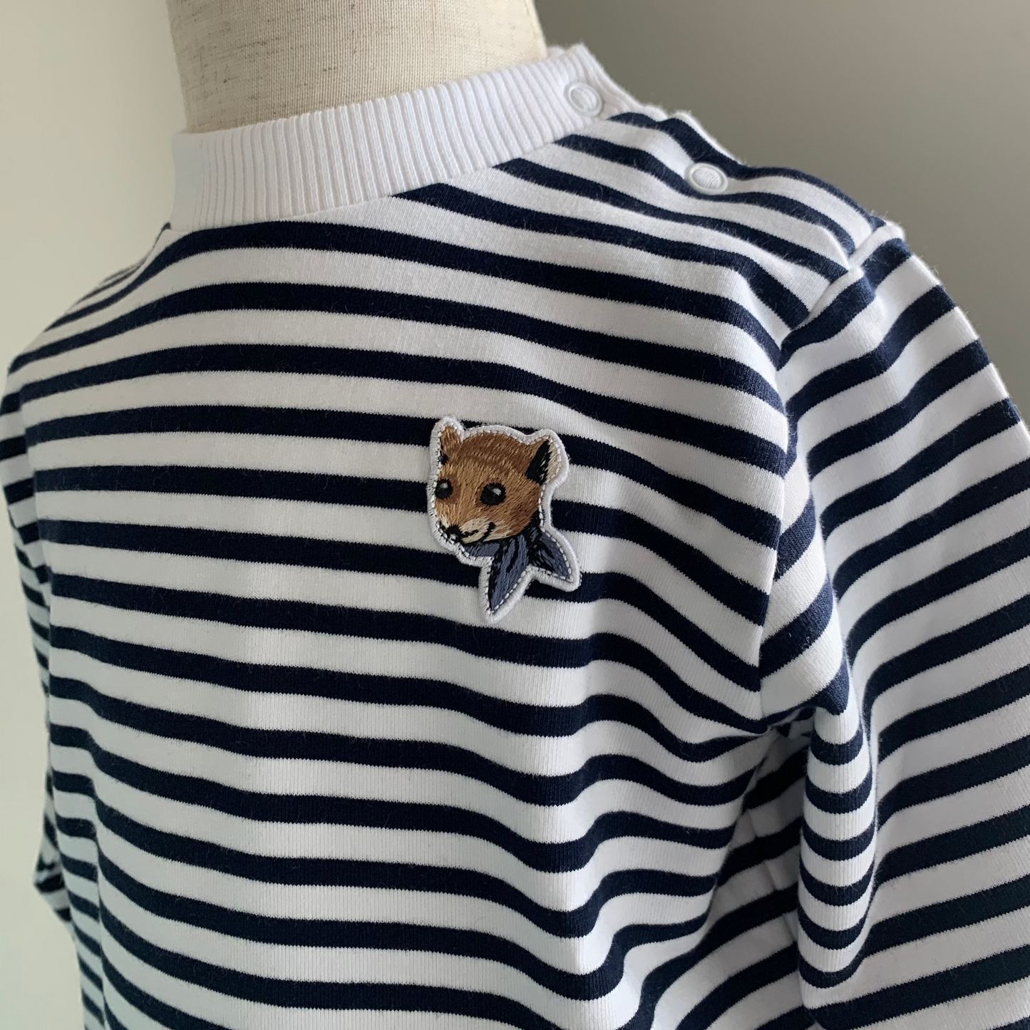 Striped Crew neck sweatshirt on mannequin, baby boy cotton crewneck. embroidered logo detail— Willowby, sizes 6–18 months